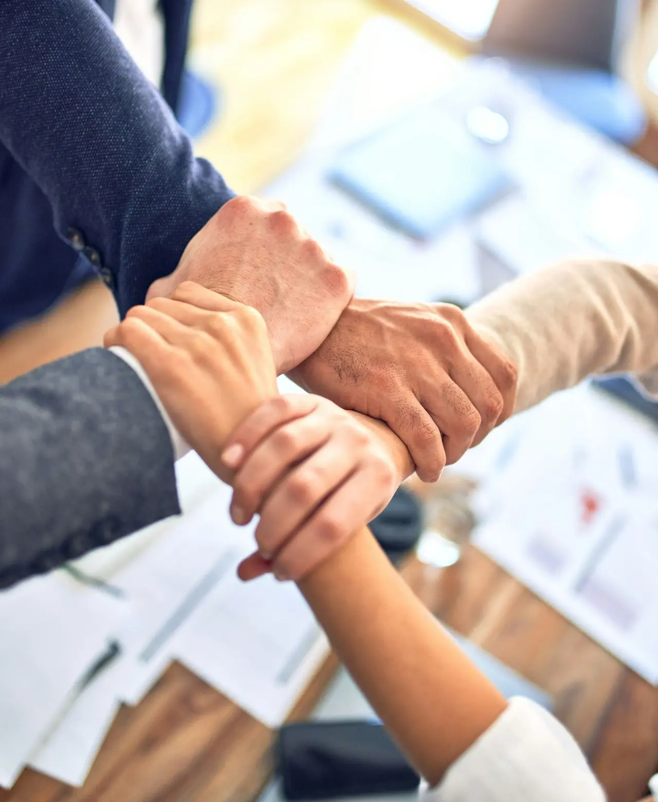 person in black long sleeve shirt holding persons hand